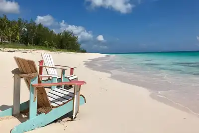Image de Comme Vu Dans Le Magazine Wanderlust! Cottage privé sur la plage de sable rose