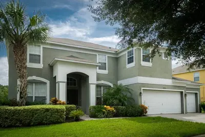 Image de Villa avec 7 chambres et 6 salles de bains, à quelques minutes de Disney World!