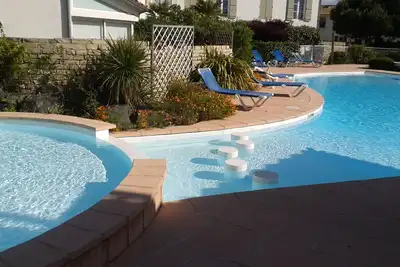 Image de Appartement de charme, à 200 m de la plage, avec jardinet dans rés. avec piscine