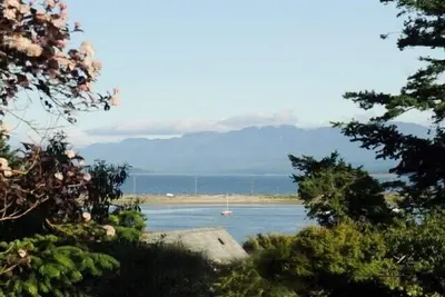 Image de Vue sur l'océan, accès à la plage, maison de campagne de 3 chambres.