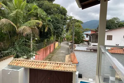 Image de Maison avec 4 suites, 4 espaces, à Praia de Boiçucanga, à 200m du sable