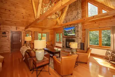 Image de Belle maison en rondins près de Mt. Neige avec bain à remous et sauna.