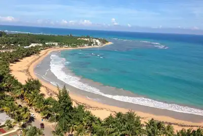 Image de Votre maison loin de chez vous! Penthouse avec une vue magnifique sur la plage!