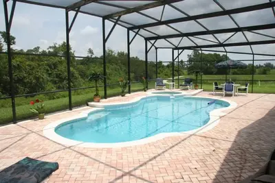 Image de Belle 4Bed / 3 salles de bain House- 3miles Disney grande piscine / spa sur le pont Xl, WiFi gratuit