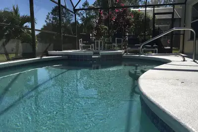 Image de Vue sur l'eau - Piscine et spa - à 5 km de Disney - WiFi - Tv / Netflix - Bbq