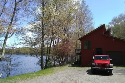Image de Bord de l'eau 7 chambres à coucher pour 14 personnes avec bateau sur la plage Animaux acceptés