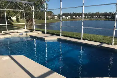 Image de Récemment rénové en 2018 Waterfront 4 Bed / 2Bath Home 12Min. chez Disney & Shops