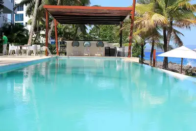 Image de Condo 1 chambre dans une résidence de luxe en bord de mer avec 2 piscines et jardin tropical