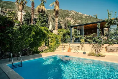 Image de Kalkan, 2 chambres ensuite, jardin et piscine privés, vue imprenable, escapade parfaite.
