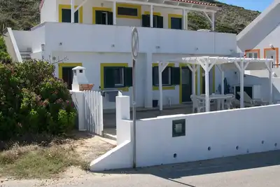 Image de Maison sur la plage de Monte Clerc surplombant la mer et le coucher du soleil