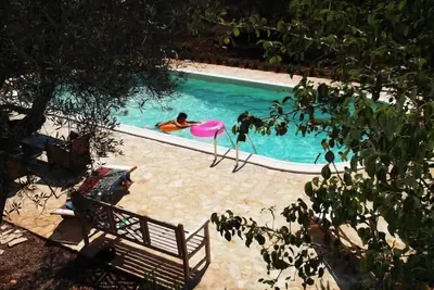 Image de Trullo Odelia offrant 3 chambres, 3 salles de bain & piscine privée sur 1, 2 ha
