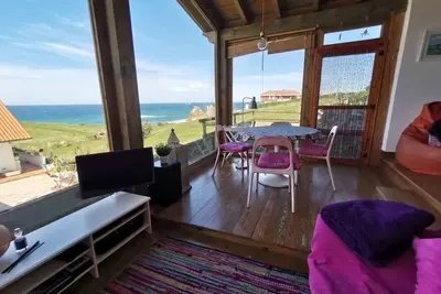 Image de Maison avec jardin sur la plage de La Arnía avec une vue imprenable sur la mer