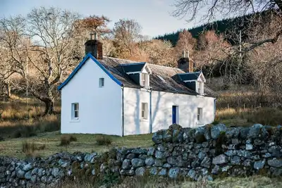 Image de Scottish Highland Holiday Cottage dans un cadre idyllique au bord du lac