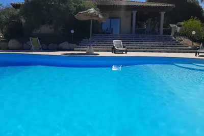 Image de Houses with garden, sea view, co-owned pool and tennis court. Sardinia