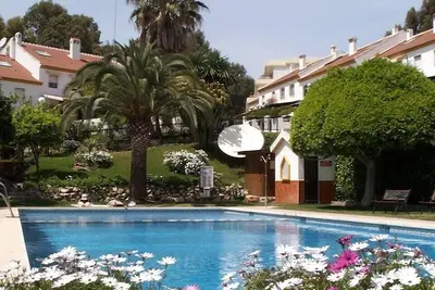 Image de 3 bedroom villa in Golf Resort, quiet, walking distance to beach, parking, pool