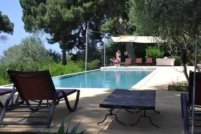 Image de Casa Laghetto avec piscine surplombant la mer