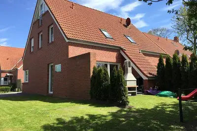 Image de Maisons de vacances et Appartements au coeur de Greetsiel, modernes, confortables + confortables, Internet