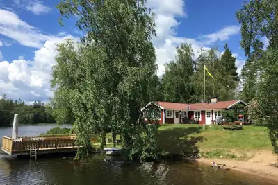 Image de Maison de vacances avec vue panoramique incl. Bateau et sauna directement sur le lac Hyllen