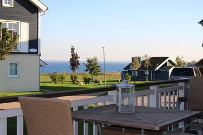 Image de Belle maison de vacances avec vue sur la mer, emplacement sur la plage, WiFi, sauna, animaux acceptés,