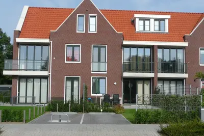 Image de Appartement neuf, 95m² Südlage, jardin, terrasse, 300m de la plage, 4 km v Vlissingen