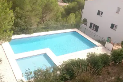 Image de Cala Galdana, maison de ville, huit personnes (4 chambres. ) Avec jardin et piscine.