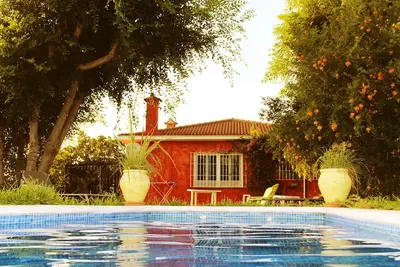Image de Dans la campagne, avec cheminée 8km du centre de SevillaMaison avec jardin
