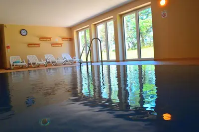 Image de Appartement confortable et moderne directement sur la plage, avec balcon, y compris piscine intérieure / sauna WiFi