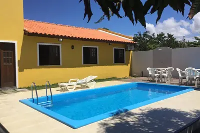 Image de Beach house dans la copropriété Aldeias do Jacuipe avec vue sur l'océan et la piscine c
