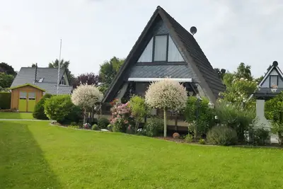 Maison située à l'extrémité dans un parc de vacances avec grand jardin
