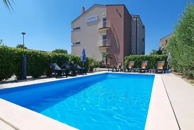 Image de Bel appartement pour 6 personnes avec climatisation, Wifi, piscine, Tv et terrasse