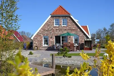 Image de Maison de vacances de luxe Moulin de la mer du Nord avec des installations de première classe directement sur la mer du Nord
