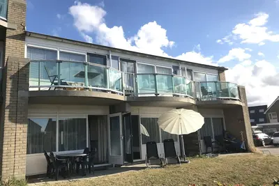 Image de Appartement directement sur la plage des dunes et la mer du Nord, terrasse, WiFi et 2 chambres