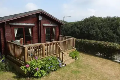 Image de Lodge avec terrasse et jardin clos