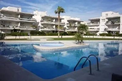 Image de Comfy beach-side apt w/ beaches, garden terrace, pool, mini golf+parking+wifi