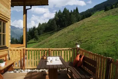 Image de Appartement \"Kreuzkogel\" dans la cabane en rondins organiques - Rindereben, Bauerndörfl