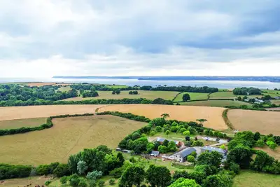 Image de Superbe conversion de grange avec piscine intérieure, cadre tranquille, emplacement côtier.