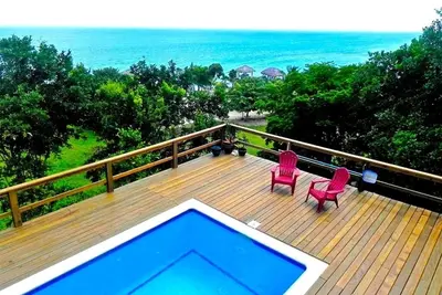 Image de Hillside Paradise Fly Fishing Flats Private 4 chambres avec vue sur la piscine et l'océan