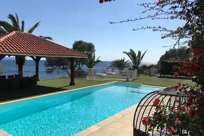 Image de Bas de Villa. Pieds dans l'eau! Vue mer superbe- Piscine privée- Jacuzzi