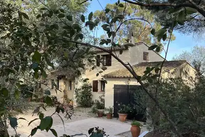 Image de Mas provençal à Grimaud avec piscine et vue sur le golfe de St-Tropez