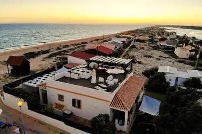 Image de Beach Villa sur la plage des dunes de Faro avec grand kayak et 2 vélos
