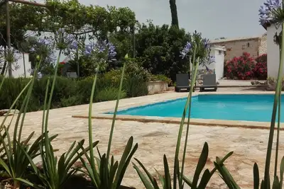 Image de Trulli magnifiquement restauré avec piscine privée de 10x5 mètres, climatisation et Wi-fi