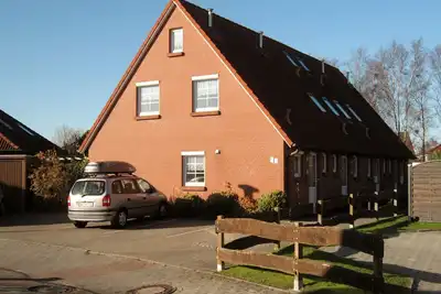 Maison d'angle en rangée, au milieu de Norddeich, endroit calme, familial, WiFi gratuit