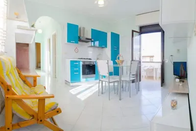 Image de Maison au premier étage à 250 mètres de la plage de sable avec guides gratuits