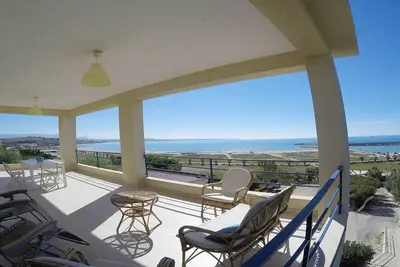 Image de A quelques pas de la plage de Porto Palo, appartement dans une villa avec vue sur mer