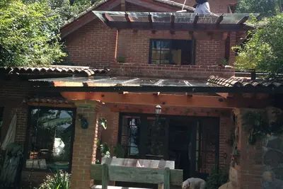 Image de Maison avec vue sur le lac, un jacuzzi et un flux