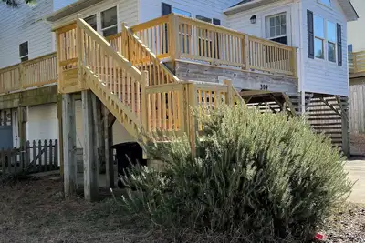 Image de Obx home, bain à remous, cheminée, vue sur l'océan nid de corneilles, cour clôturée, table de billard, vélos