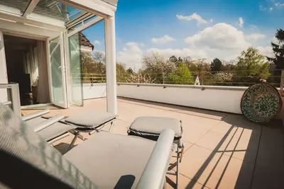 Image de Appartement \"Flair\" 95 m², 2 chambres, terrasse sur le toit jardin d'hiver, ambiance