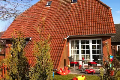 Image de Maisons de vacances et Appartements au coeur de Greetsiel, modernes, confortables + confortables, Internet