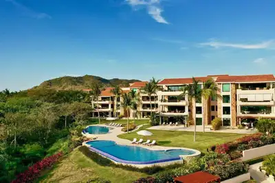 Image de Condo de luxe avec vue sur l'océan, voiturette de golf et cuisinier - Abonnement Premier inclus!