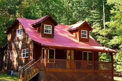 Image de Intimité dans les montagnes - bain à remous, très grands lits, foyer